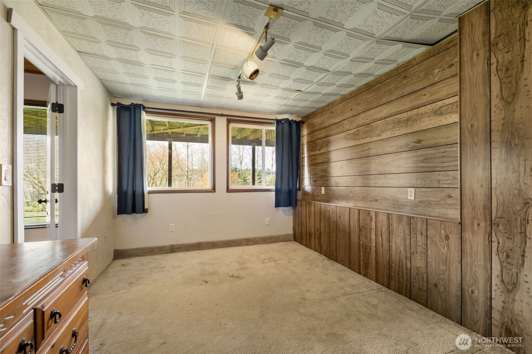 11782 Schold Road Northwest Silverdale, WA 98383 - Photo 21 of 40 a room with window and wooden walls