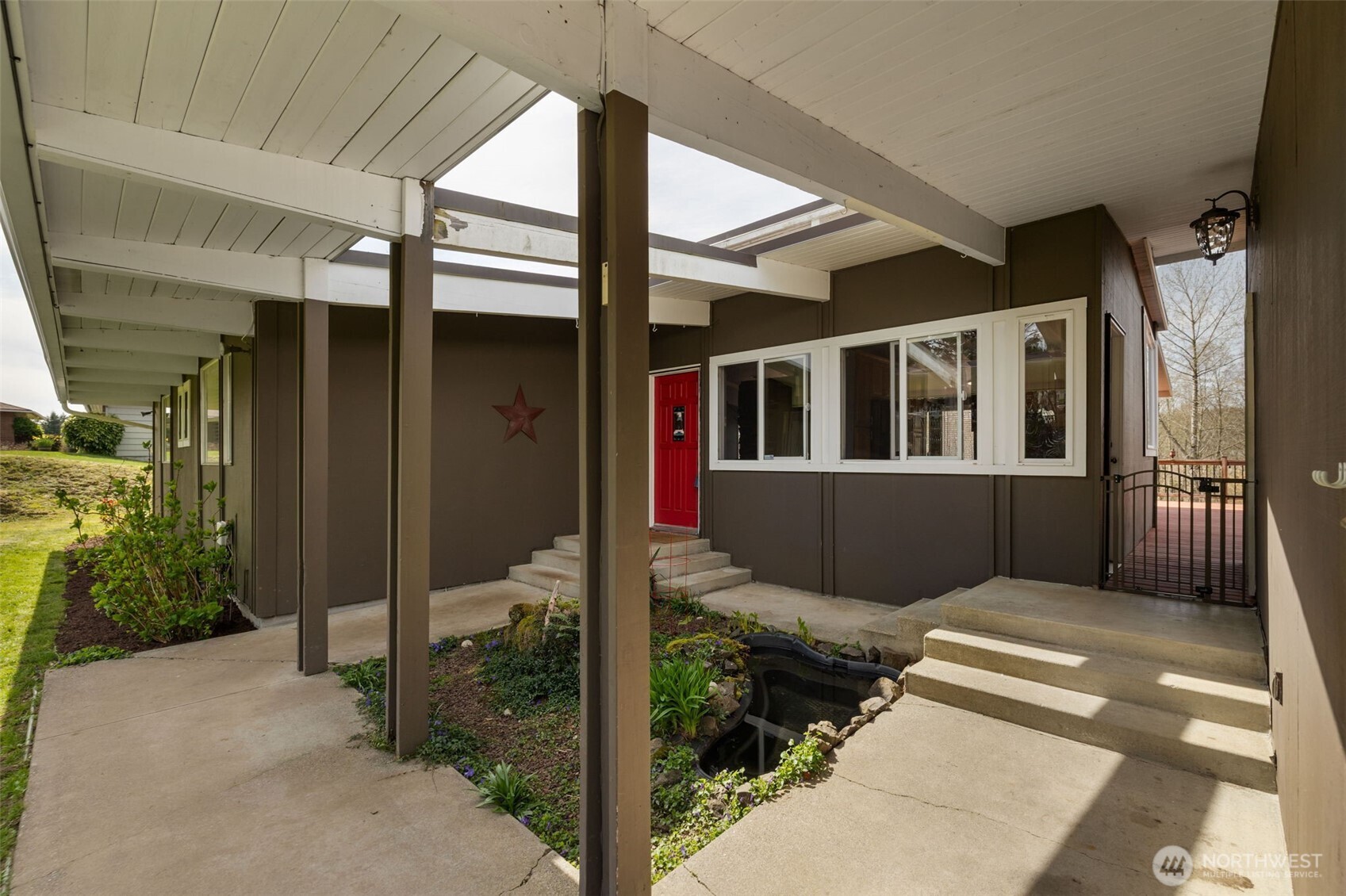 11782 Schold Road Northwest Silverdale, WA 98383 - Photo 33 of 40 a view of a house with a porch