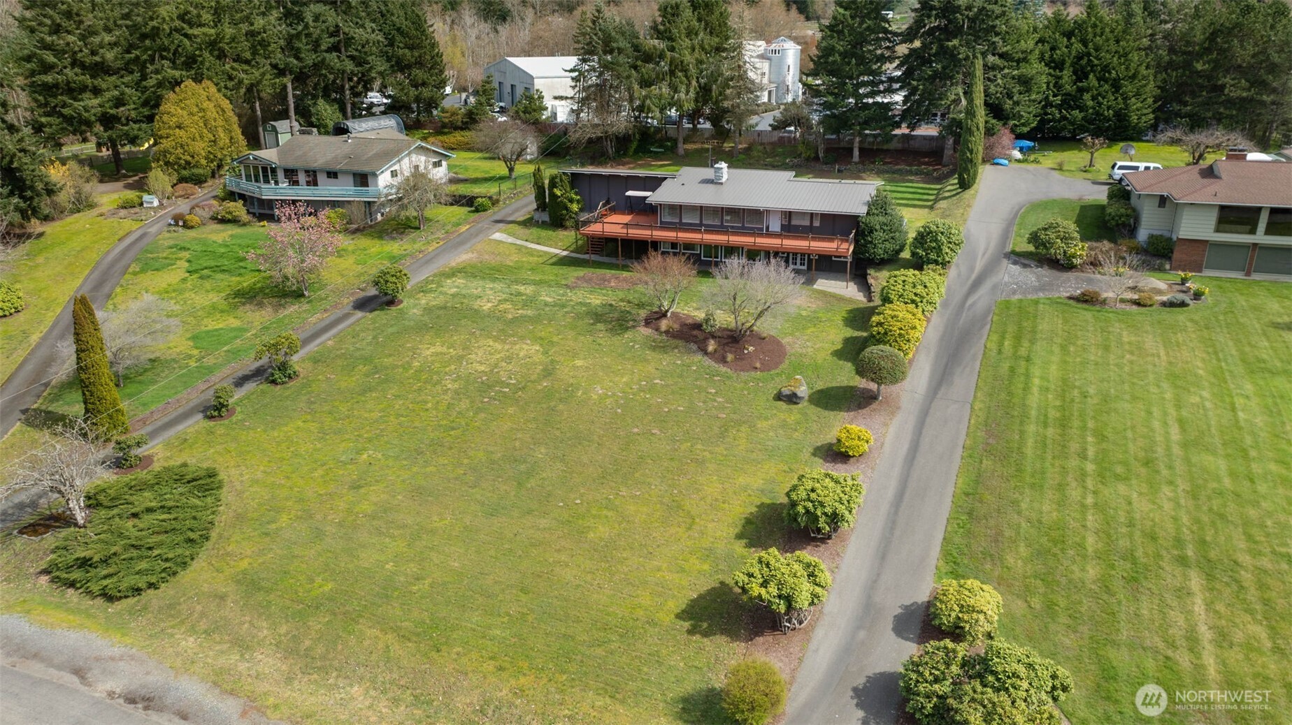 11782 Schold Road Northwest Silverdale, WA 98383 - Photo 39 of 40 a aerial view of a house with swimming pool and garden