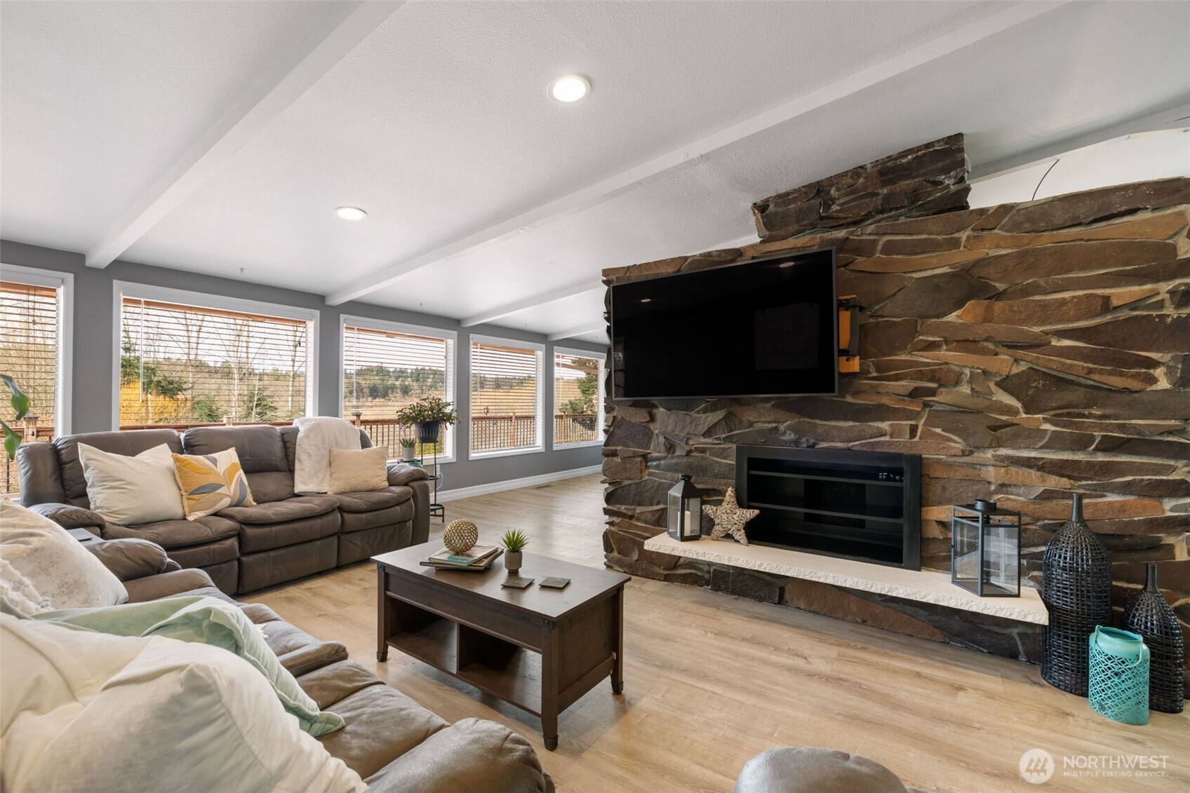 11782 Schold Road Northwest Silverdale, WA 98383 - Photo 4 of 40 a living room with fireplace furniture and a flat screen tv