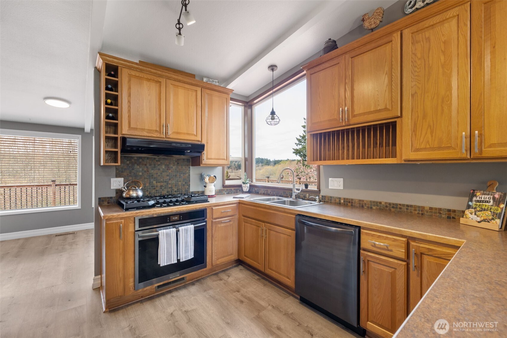 11782 Schold Road Northwest Silverdale, WA 98383 - Photo 7 of 40 a kitchen with stainless steel appliances granite countertop a stove sink and cabinets