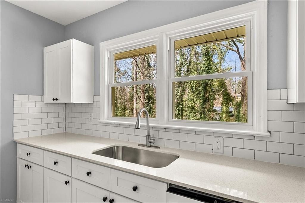 2763 Baker Ridge Drive Northwest Atlanta, GA 30318 - Photo 12 of 32 a kitchen with a sink and a window