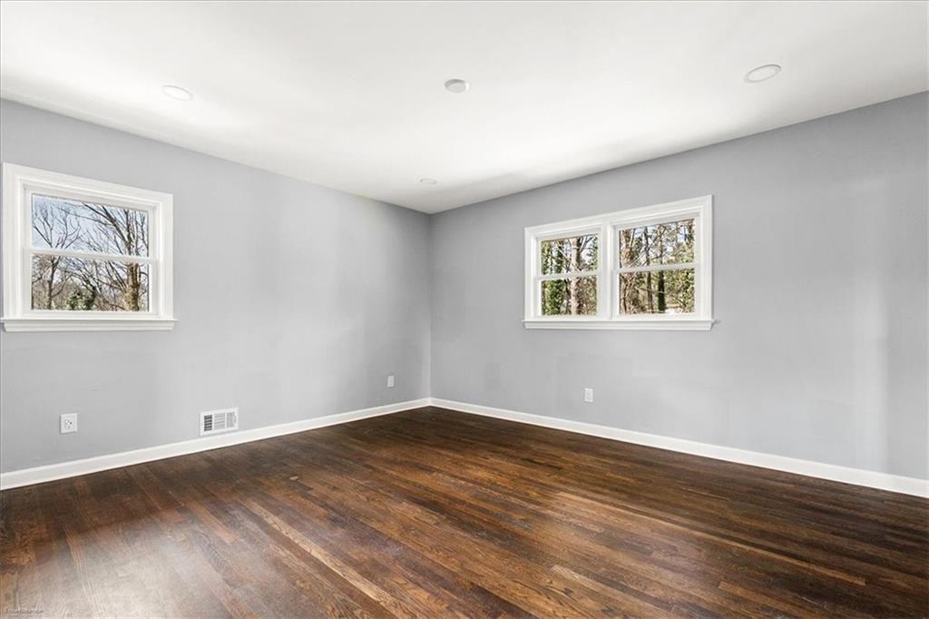 2763 Baker Ridge Drive Northwest Atlanta, GA 30318 - Photo 15 of 32 a view of empty room with wooden floor