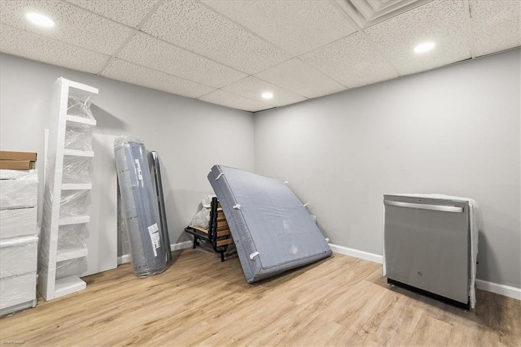 2763 Baker Ridge Drive Northwest Atlanta, GA 30318 - Photo 21 of 32 a room with furniture and wooden floor