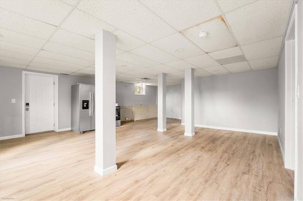 2763 Baker Ridge Drive Northwest Atlanta, GA 30318 - Photo 24 of 32 a view of a big room with wooden floor and windows