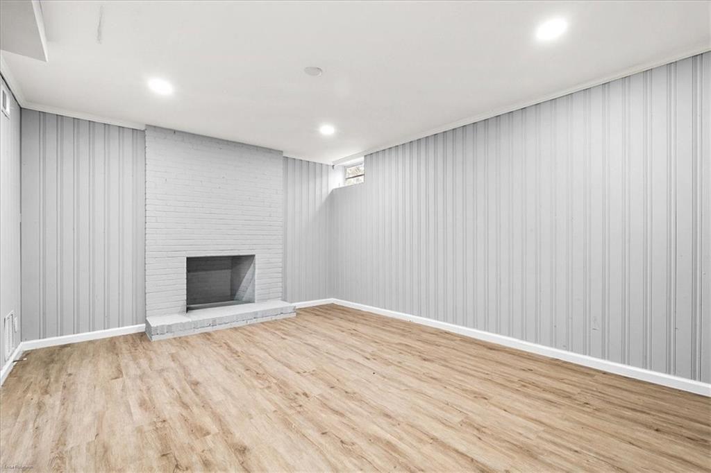 2763 Baker Ridge Drive Northwest Atlanta, GA 30318 - Photo 25 of 32 a view of an empty room with wooden floor