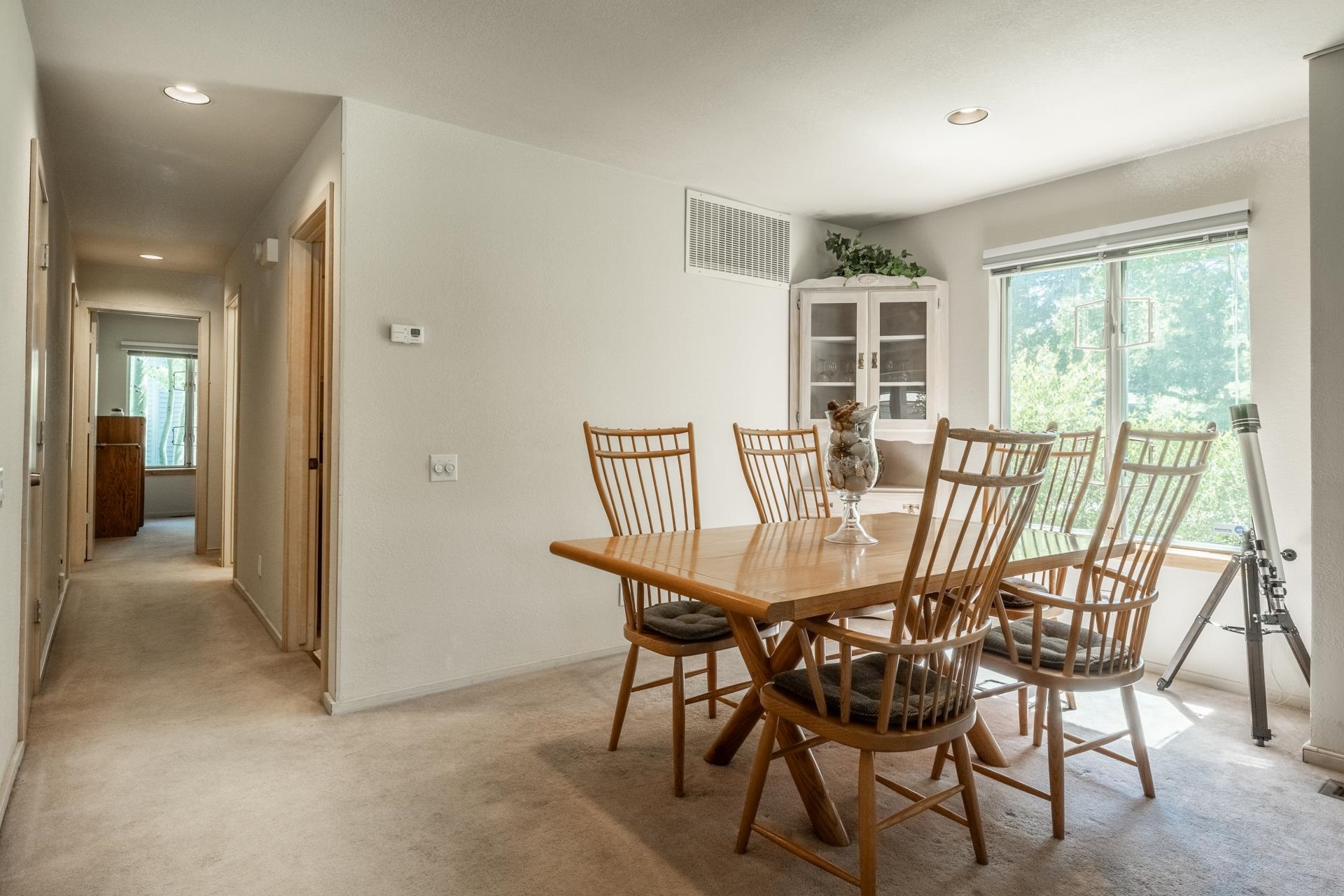 609 Golden Creek Road, Unit 609 Mammoth Lakes, CA 93546 - Photo 22 of 42 Dining area featuring a corner built-in display cabinet and a large window