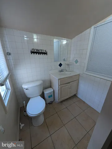 a bathroom with a toilet a sink and a bathtub