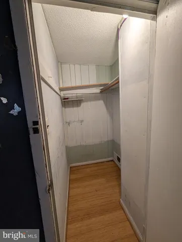 a view of an empty walk in closet
