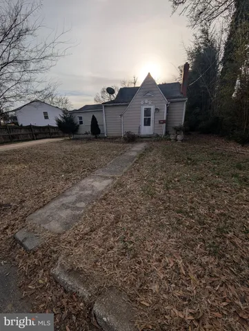 a view of a large house with a yard