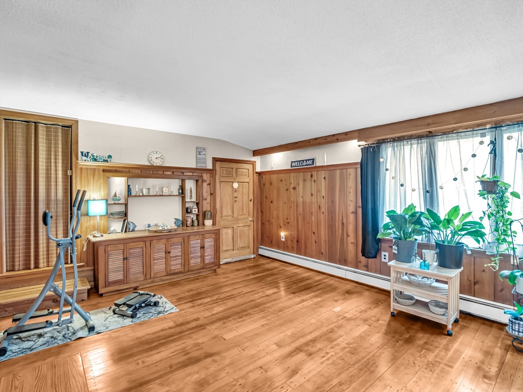 173 Bennett Road Hampden, MA 01036 - Photo 23 of 35 a living room with furniture and a wooden floor