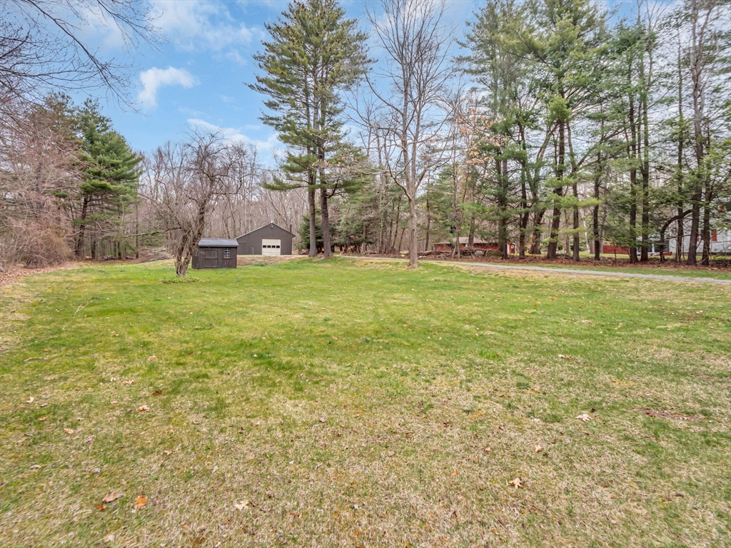 173 Bennett Road Hampden, MA 01036 - Photo 30 of 35 a backyard of apartments with large trees