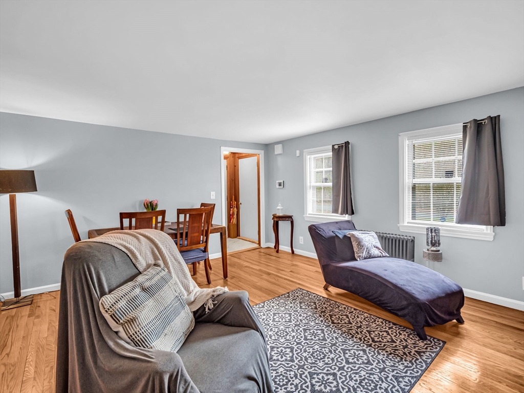 173 Bennett Road Hampden, MA 01036 - Photo 6 of 35 a living room with furniture two windows and a rug