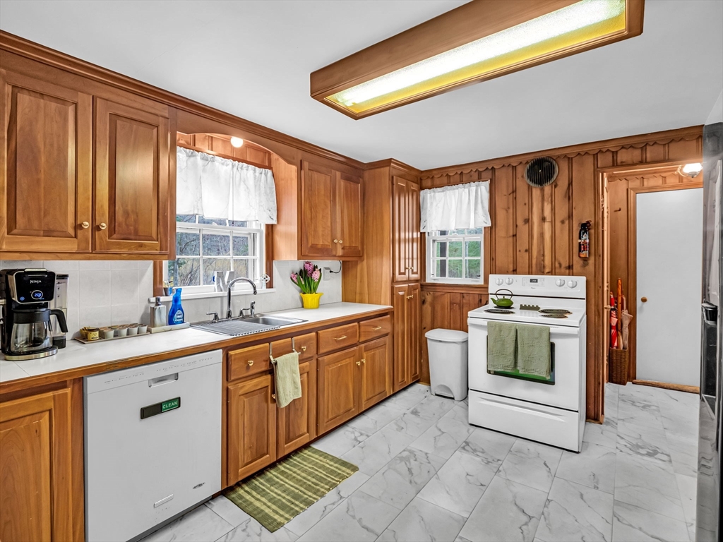 173 Bennett Road Hampden, MA 01036 - Photo 7 of 35 a kitchen with a stove sink and cabinets