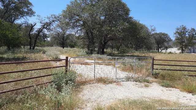 a view of a backyard of the house