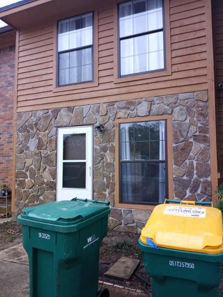 226 Pelham Road, Unit 6 Fort Walton Beach, FL 32547 - Photo 1 of 9 a view of a house with a tub and a fire pit