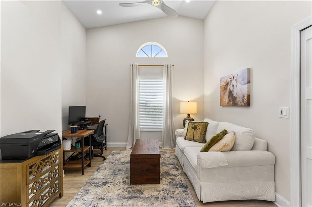 754 Wiggins Bay Drive Naples, FL 34110 - Photo 22 of 34 a workspace with furniture and couch