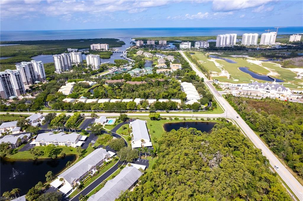 754 Wiggins Bay Drive Naples, FL 34110 - Photo 27 of 34 a view of swimming pool with outdoor seating