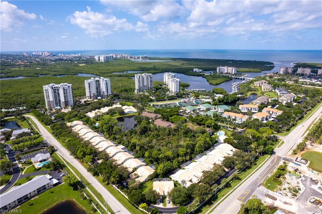 754 Wiggins Bay Drive Naples, FL 34110 - Photo 28 of 34 a terrace with outdoor seating and city view