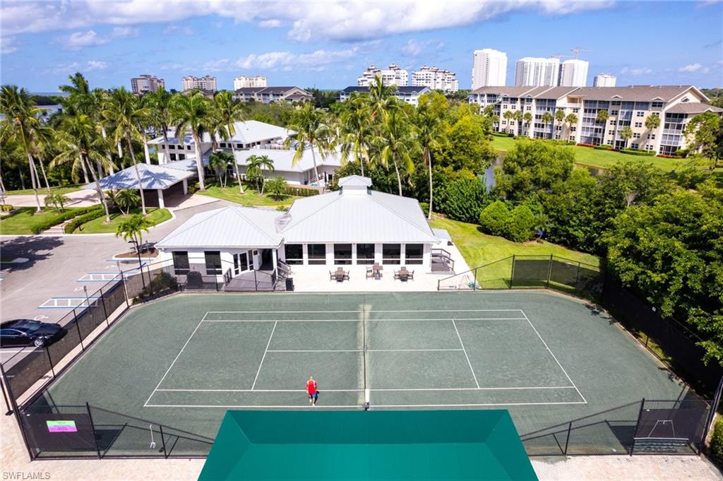754 Wiggins Bay Drive Naples, FL 34110 - Photo 30 of 34 a view of a city that has tall buildings