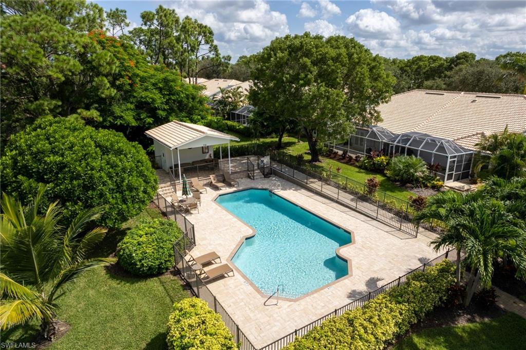 754 Wiggins Bay Drive Naples, FL 34110 - Photo 32 of 34 an aerial view of a house with a garden and lake view