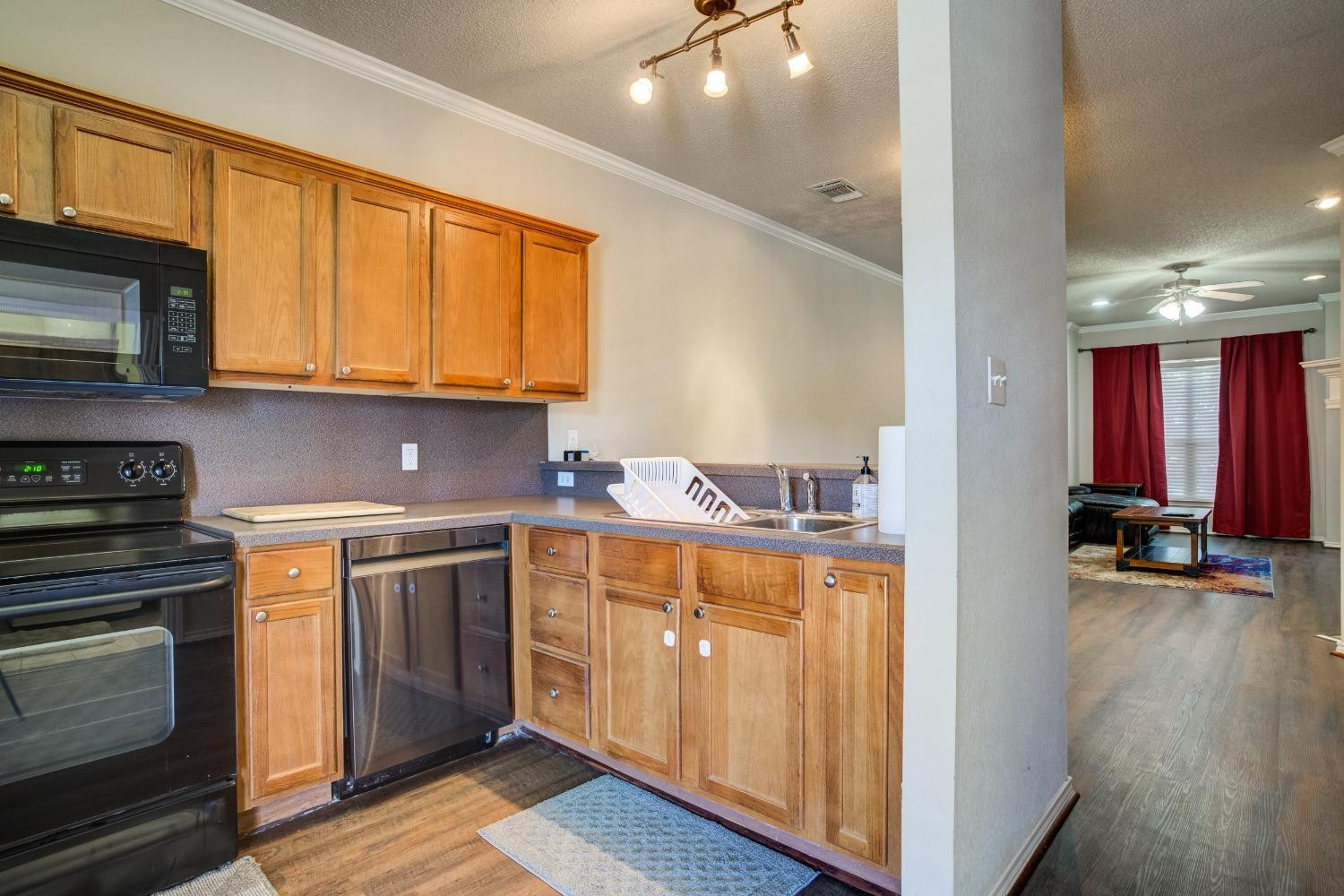 2101 Main Street, Unit 2 Lubbock, TX 79401 - Photo 14 of 31 a kitchen with stainless steel appliances granite countertop a stove and a sink