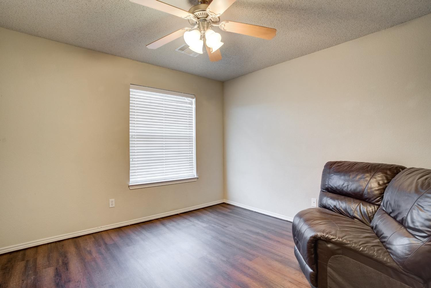 2101 Main Street, Unit 2 Lubbock, TX 79401 - Photo 28 of 31 a living room with furniture and a window