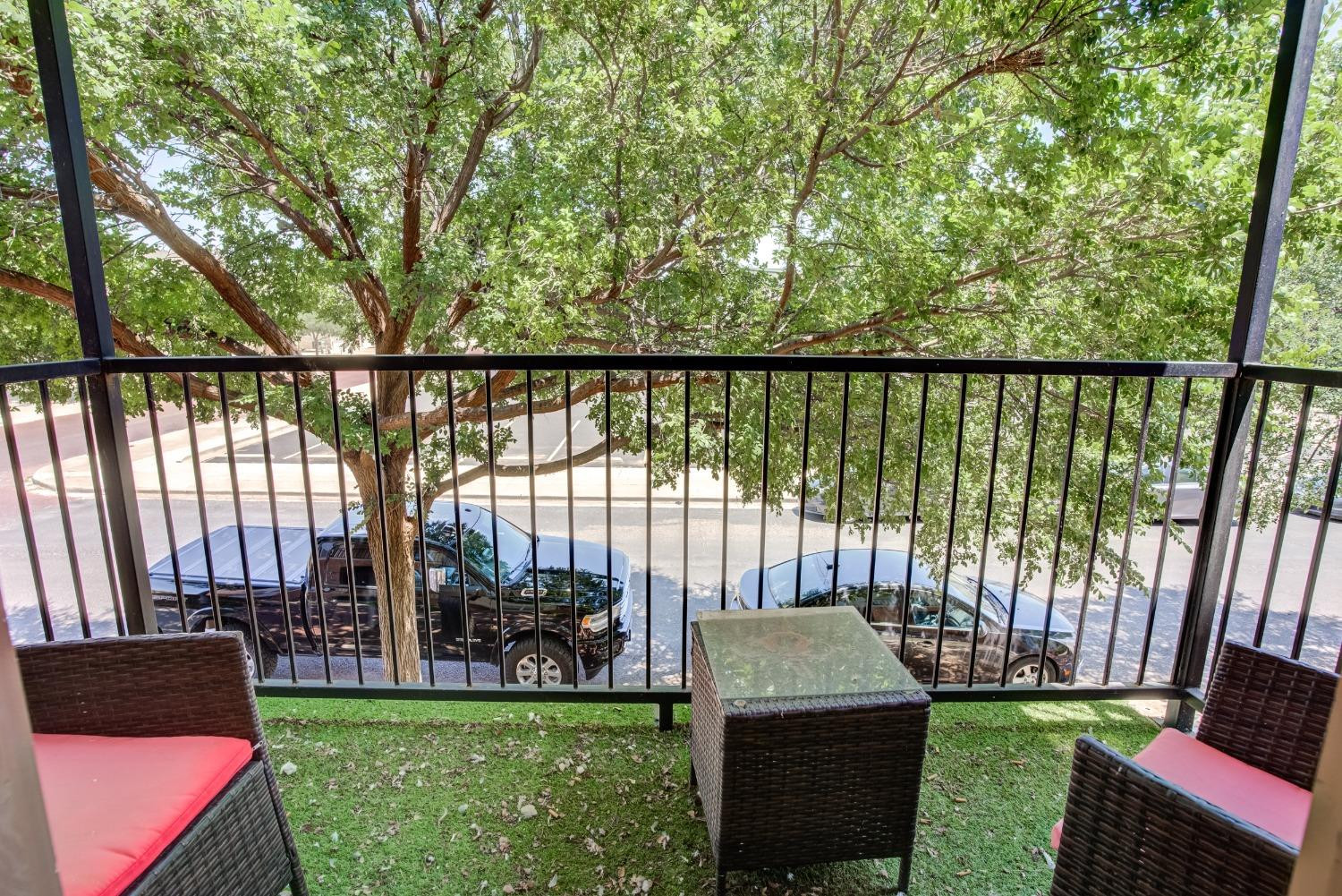 2101 Main Street, Unit 2 Lubbock, TX 79401 - Photo 31 of 31 a view of a deck with a floor to ceiling window and a yard