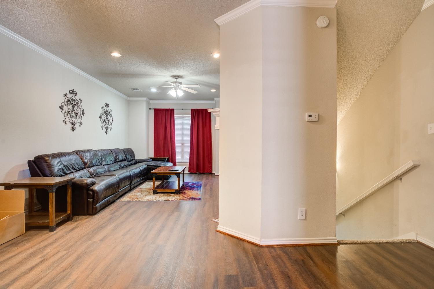2101 Main Street, Unit 2 Lubbock, TX 79401 - Photo 4 of 31 a living room with furniture and wooden floor