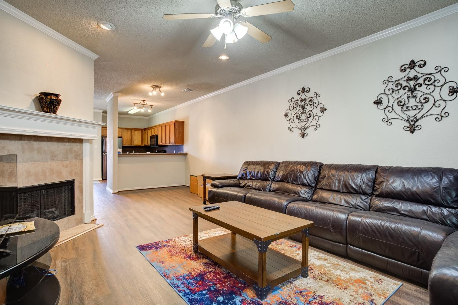 2101 Main Street, Unit 2 Lubbock, TX 79401 - Photo 8 of 31 a living room with furniture and a fireplace