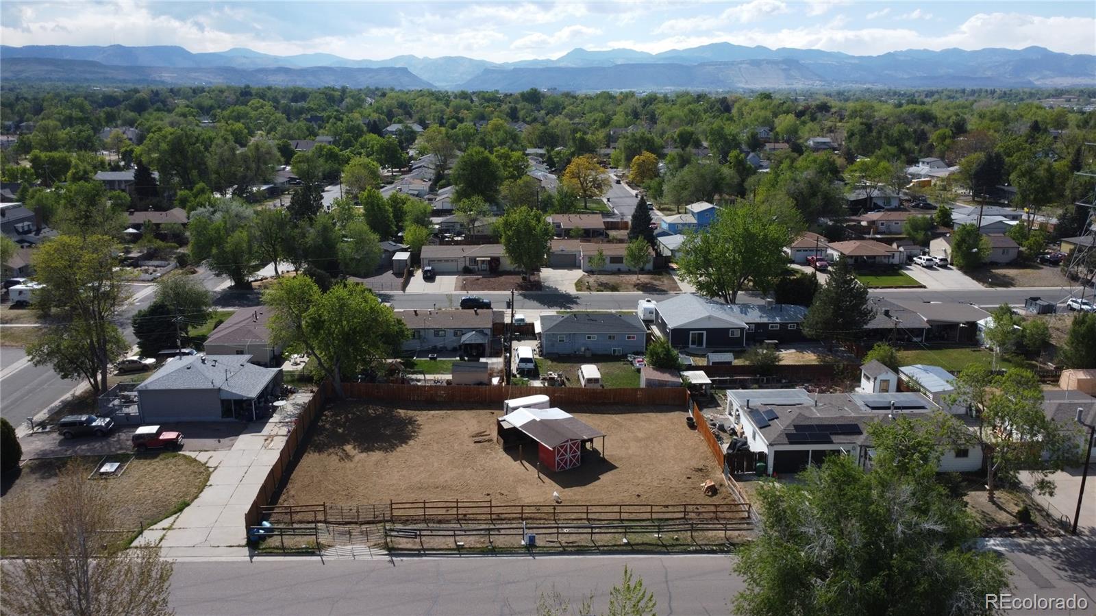 3875 Nelson Street Wheat Ridge, CO 80033 - Photo 1 of 1 an aerial view of a house with a yard