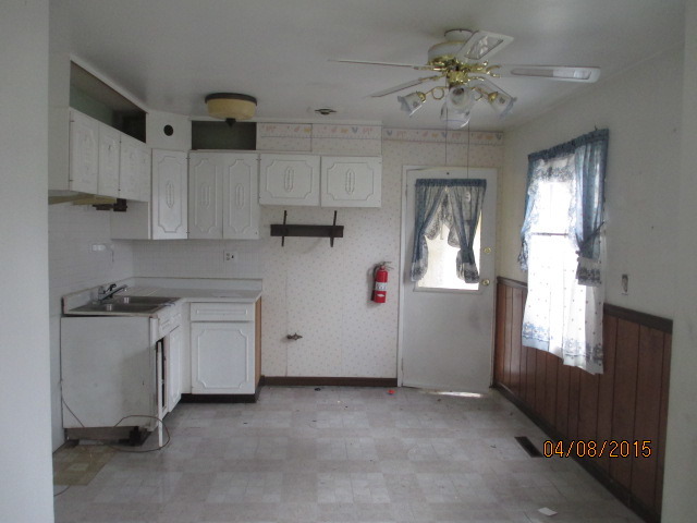 119 East Oltendorf Road Streamwood, IL 60107 - Photo 4 of 11 a kitchen with cabinets and window