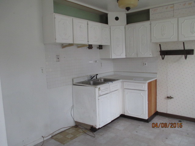 119 East Oltendorf Road Streamwood, IL 60107 - Photo 5 of 11 a kitchen with granite countertop white cabinets and white appliances