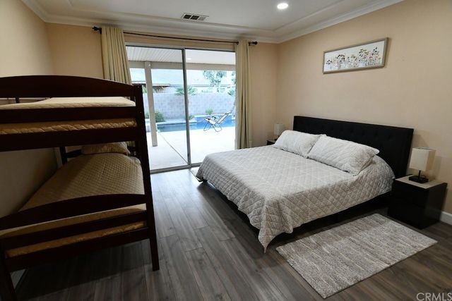 a view of a dining room with furniture and window