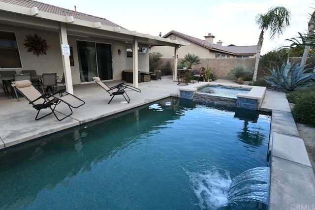 a view of a livingroom with furniture and window