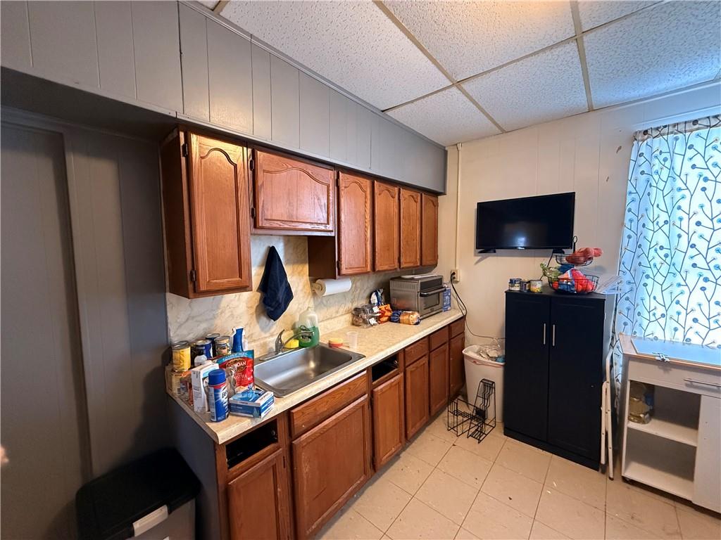 325 West Cunningham Street Butler, PA 16001 - Photo 12 of 18 a kitchen that has a sink and a stove in it