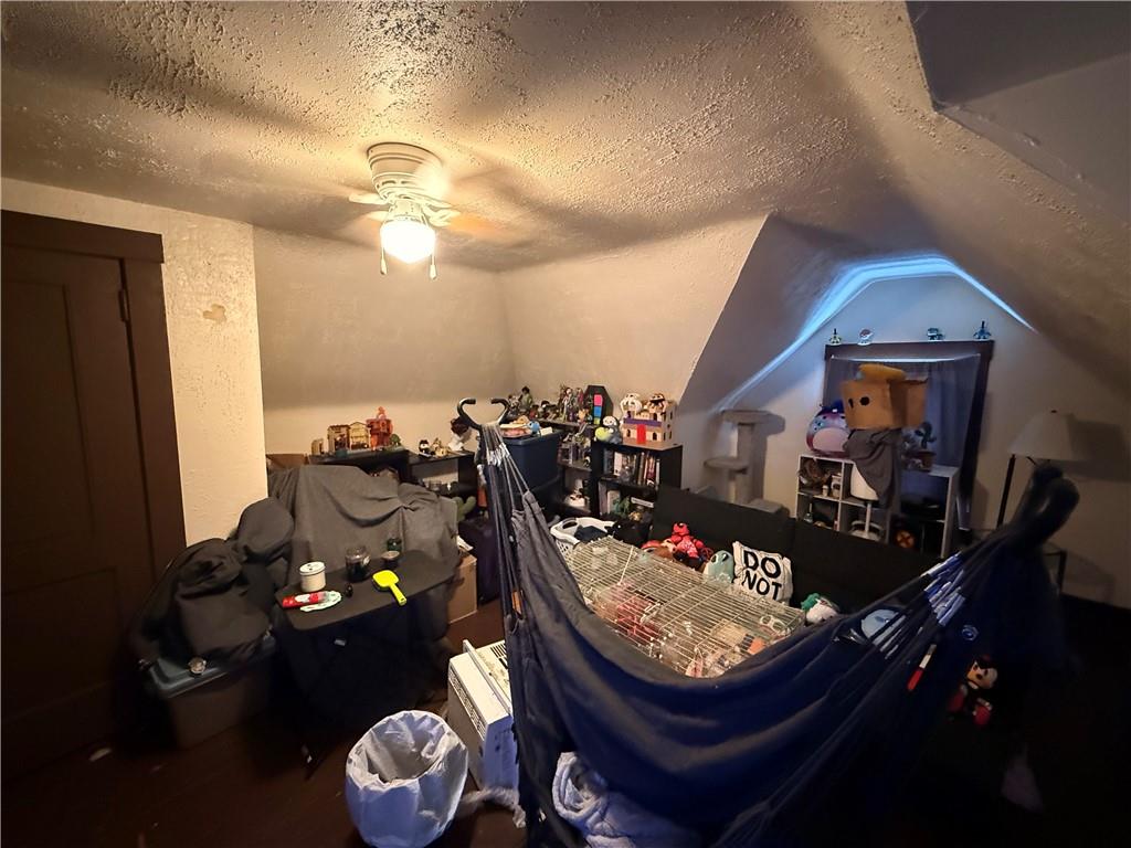 325 West Cunningham Street Butler, PA 16001 - Photo 14 of 18 a living room with furniture a rug and a chandelier