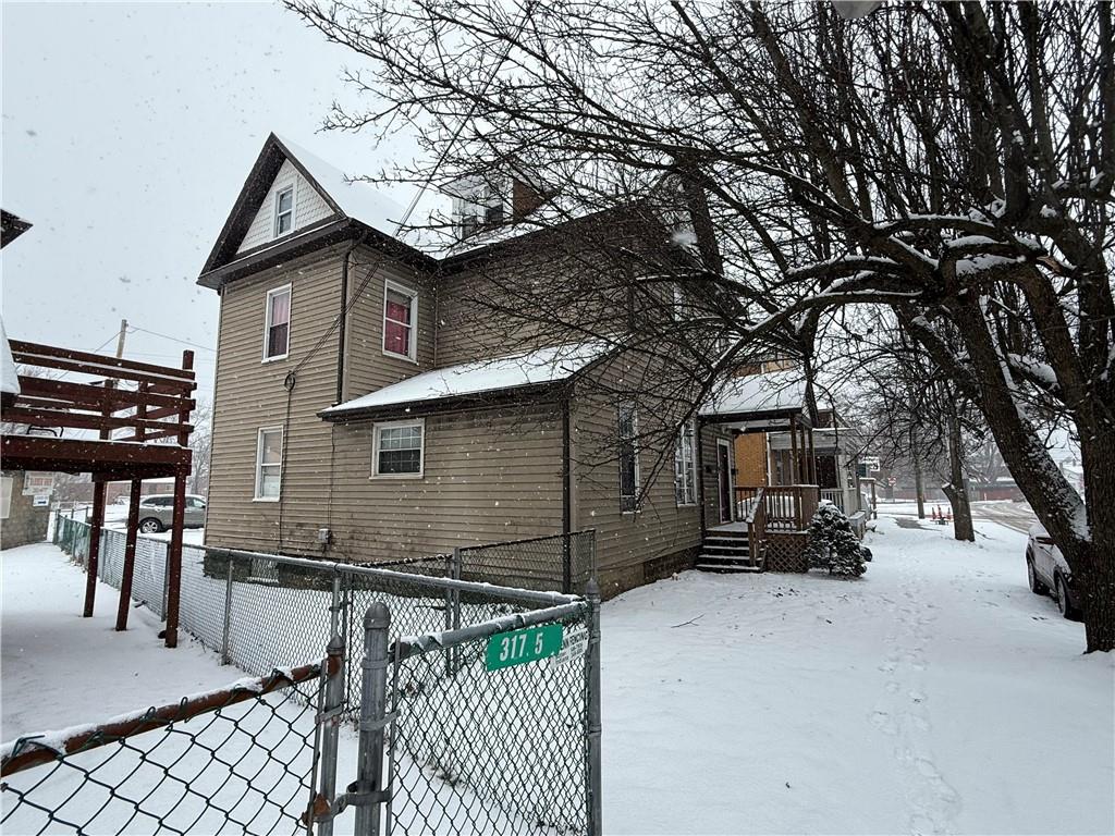 325 West Cunningham Street Butler, PA 16001 - Photo 18 of 18 a view of house with outdoor space and car parked