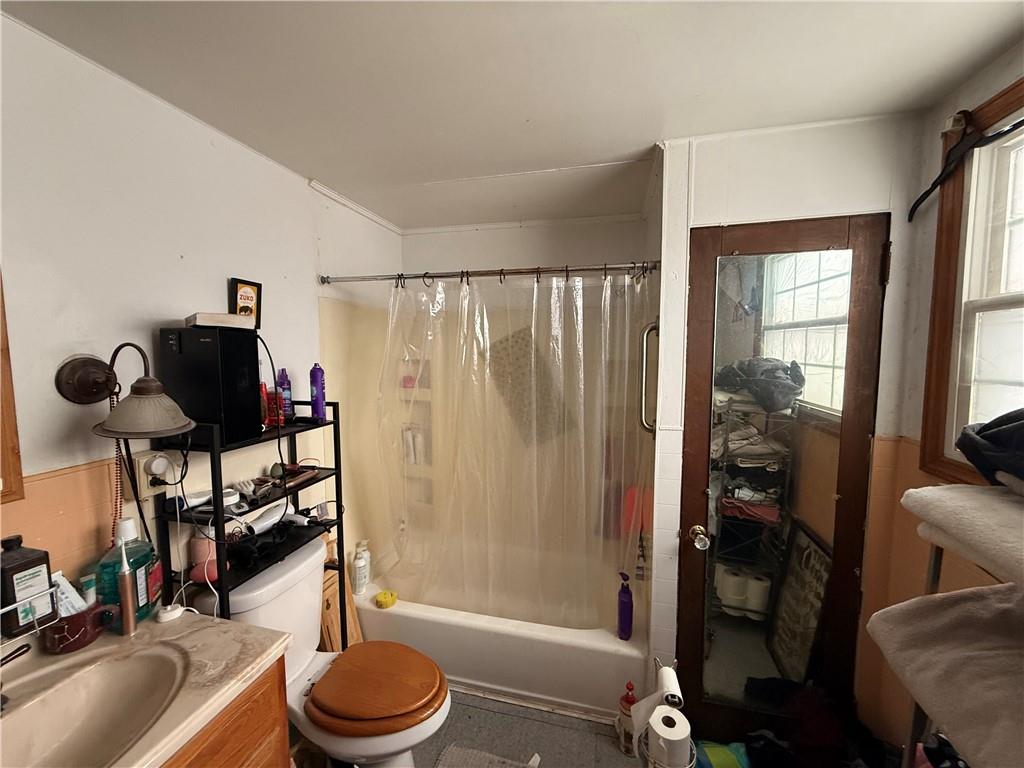 325 West Cunningham Street Butler, PA 16001 - Photo 6 of 18 a bathroom with a granite countertop sink toilet and shower
