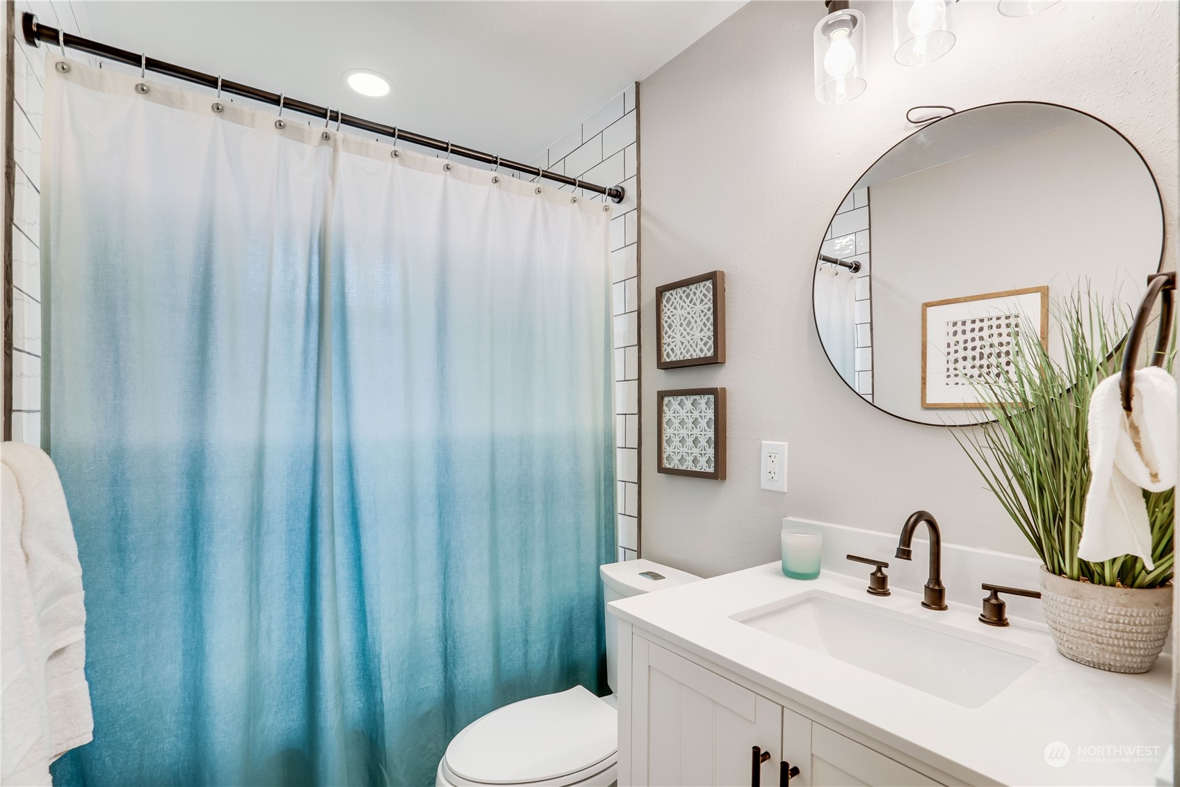 1209 South Donovan Street Seattle, WA 98108 - Photo 13 of 19 a bathroom with a sink mirror and toilet