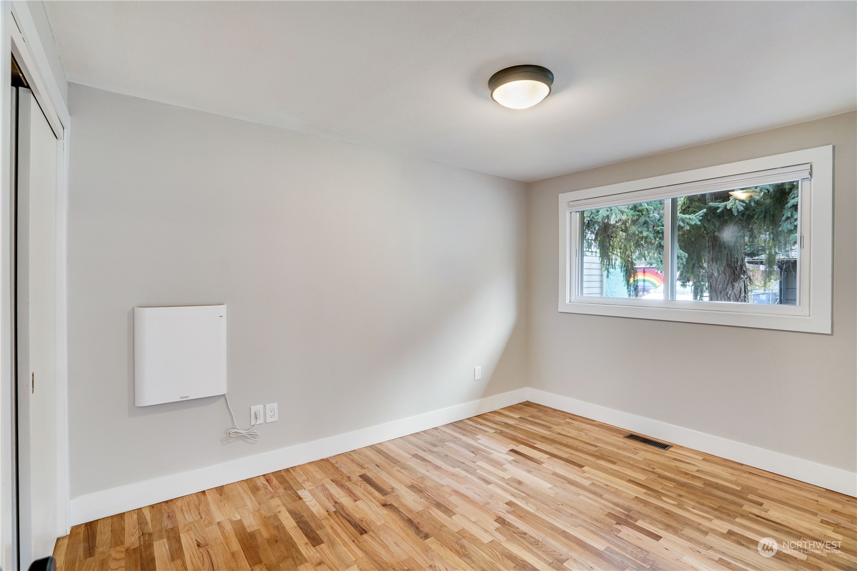 1209 South Donovan Street Seattle, WA 98108 - Photo 14 of 19 a view of empty room with wooden floor and fan