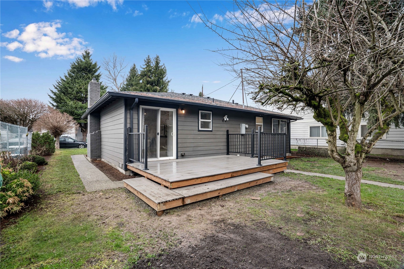 1209 South Donovan Street Seattle, WA 98108 - Photo 16 of 19 a view of a house with backyard and a tree