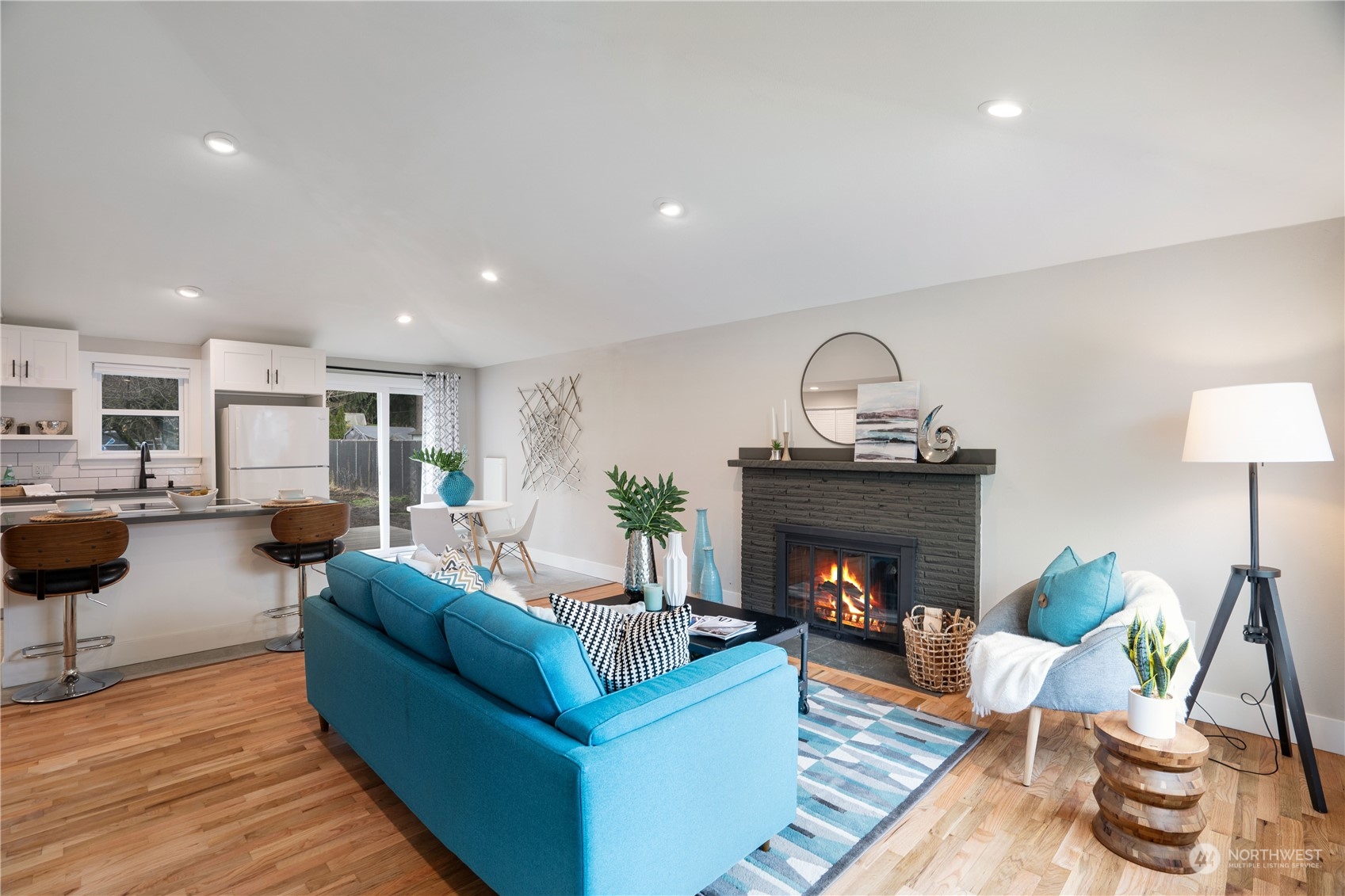 1209 South Donovan Street Seattle, WA 98108 - Photo 3 of 19 a living room with furniture and a fireplace