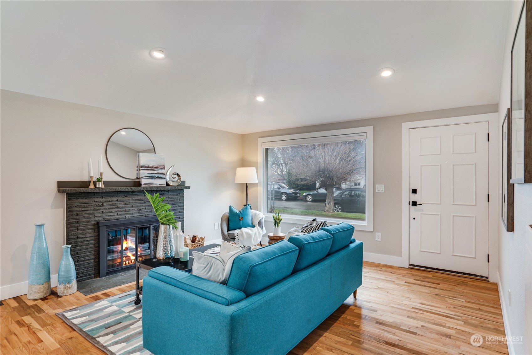 1209 South Donovan Street Seattle, WA 98108 - Photo 5 of 19 a living room with furniture and a fireplace