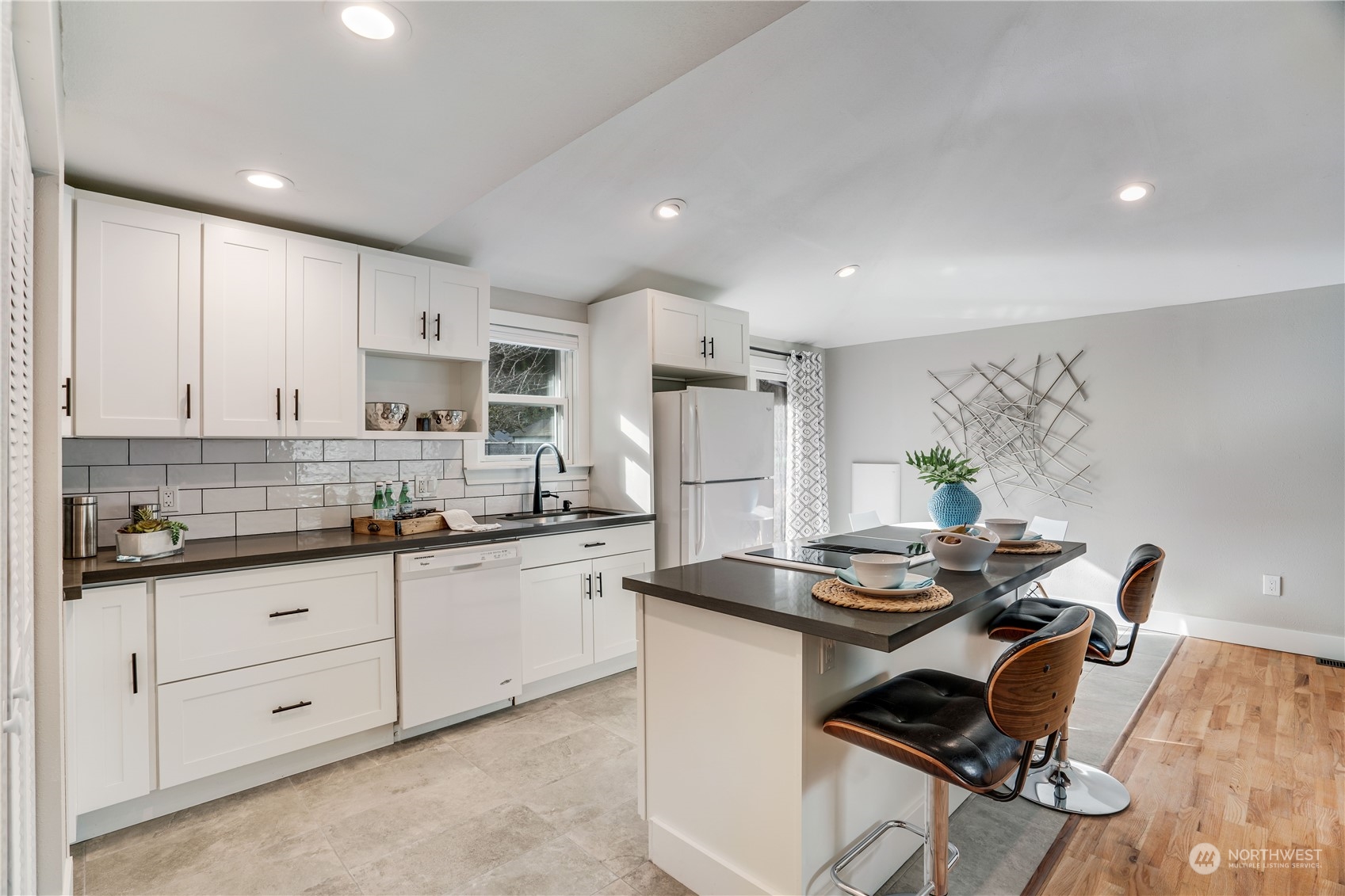 1209 South Donovan Street Seattle, WA 98108 - Photo 7 of 19 a kitchen with stainless steel appliances granite countertop a stove a sink dishwasher and a refrigerator