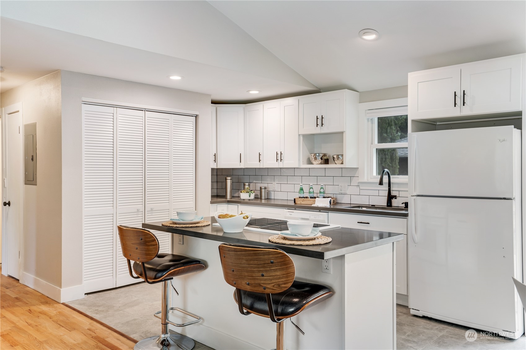 1209 South Donovan Street Seattle, WA 98108 - Photo 9 of 19 a kitchen with stainless steel appliances granite countertop a stove and a refrigerator