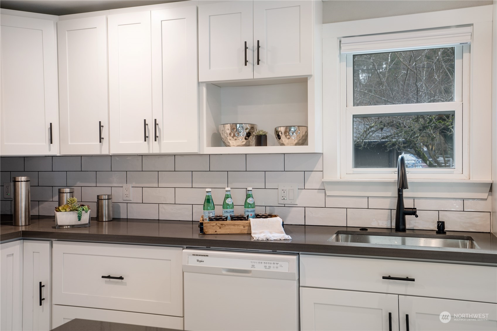 1209 South Donovan Street Seattle, WA 98108 - Photo 10 of 19 a kitchen with white cabinets and a window