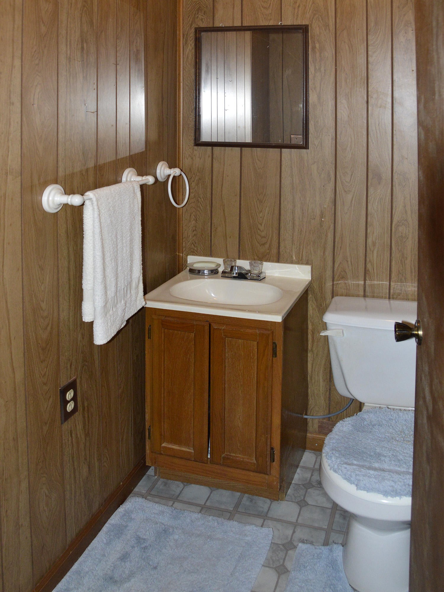 244 Sallings Road Luttrell, TN 37779 - Photo 13 of 19 a bathroom with a sink and mirror with toilet