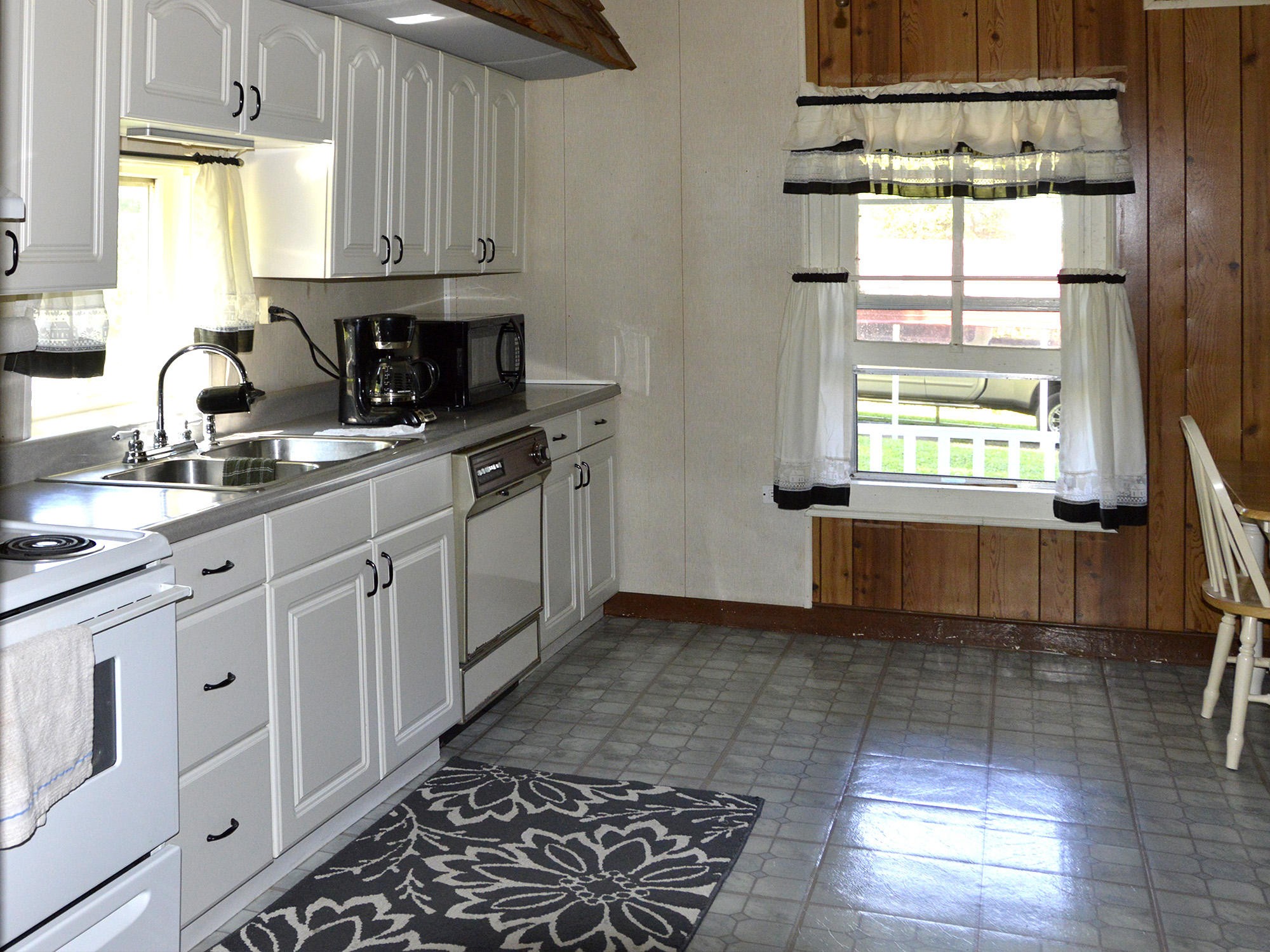 244 Sallings Road Luttrell, TN 37779 - Photo 5 of 19 a kitchen with stainless steel appliances granite countertop a sink a stove a cabinets and a window