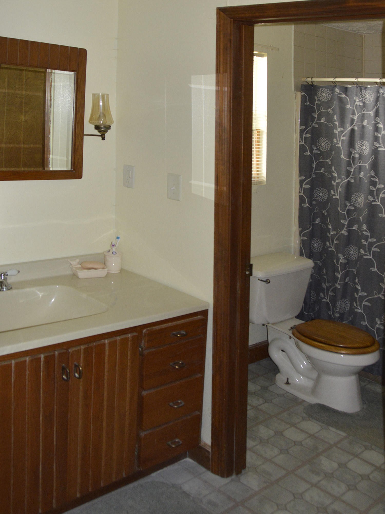 244 Sallings Road Luttrell, TN 37779 - Photo 10 of 19 a bathroom with a toilet a sink and a mirror